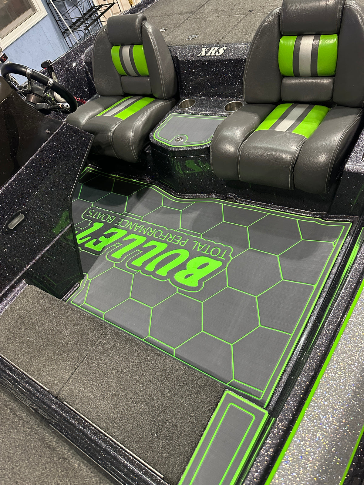 Boat cockpit with patterned marine flooring and seating