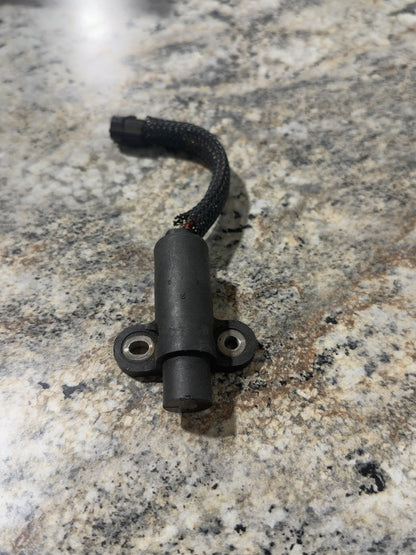 Actual used Mercury crankshaft position sensor 8M0082988 showing attached lead and sleeve wear